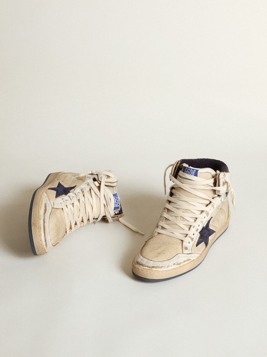 herr sky-star i krämfärgad nylon och läder med blå mockastjärna