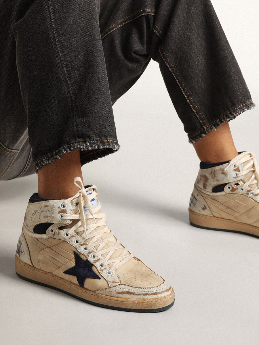 herr sky-star i krämfärgad nylon och läder med blå mockastjärna