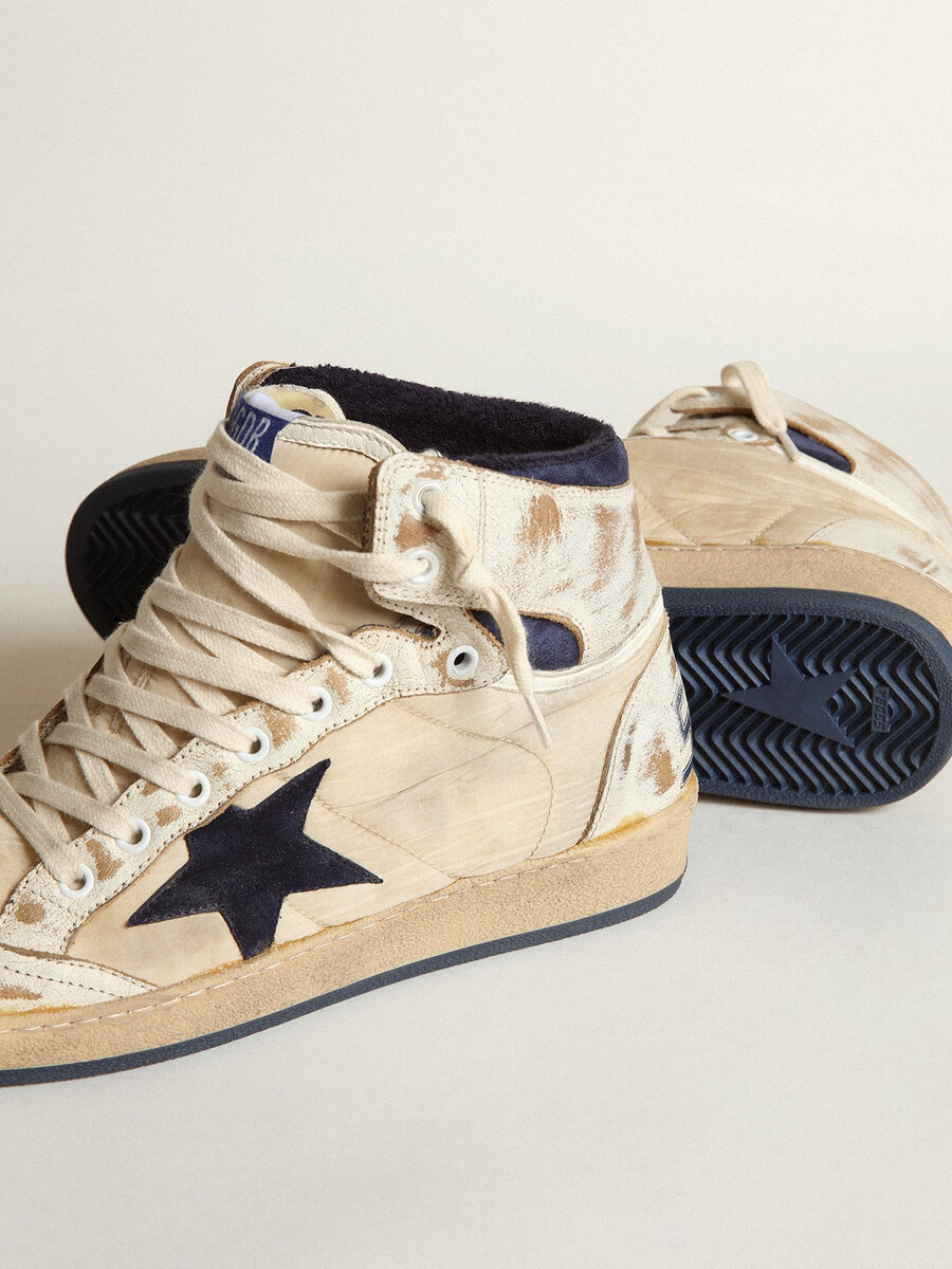 herr sky-star i krämfärgad nylon och läder med blå mockastjärna
