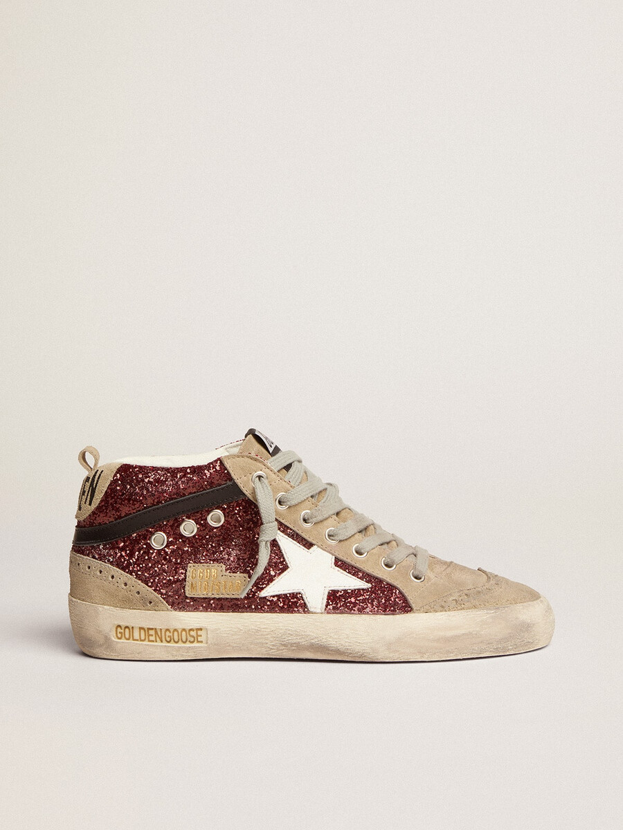 dam mid star i vinrött glitter med grått inlägg och vit stjärna