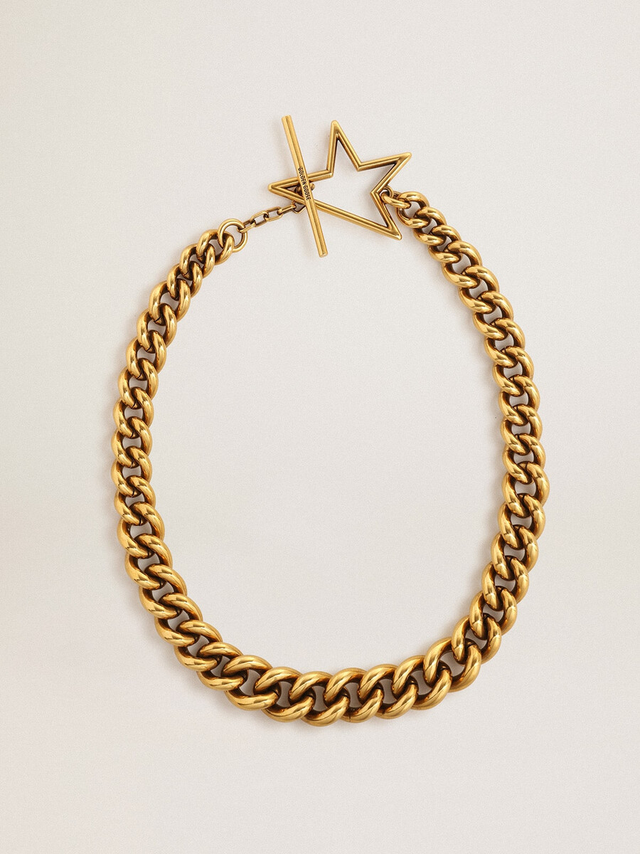 halsband i antikguld avtagande kedja med stjärnformat spänne
