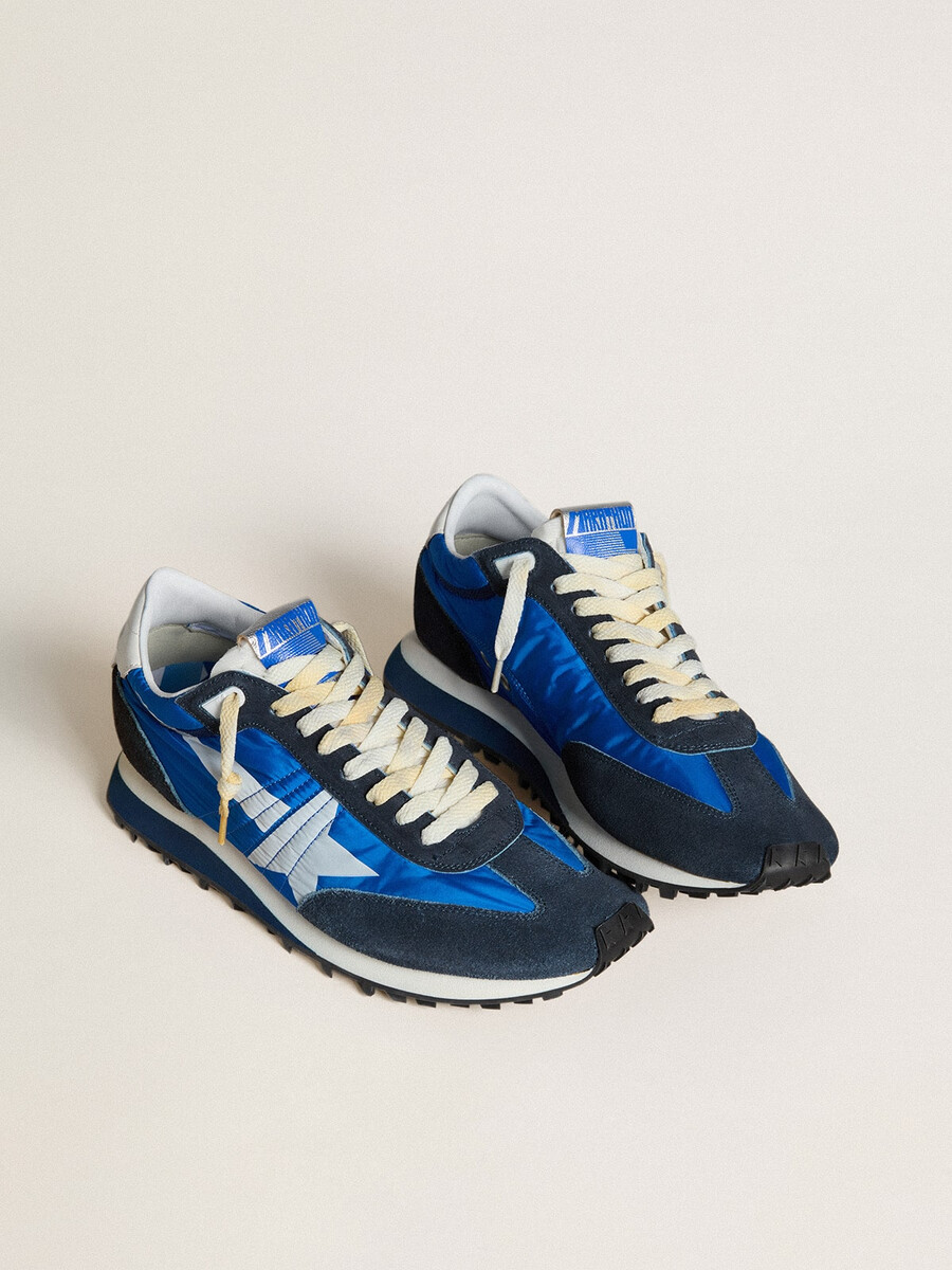 herrmarathon med blå nylonovandel och vit stjärna