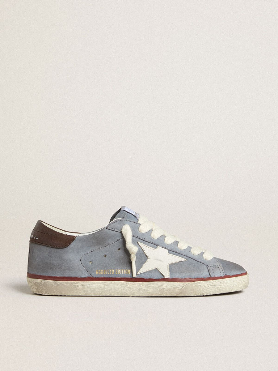 superstar ltd i ljusblått nubuckläder med vit läderstjärna och brun läderhälflik