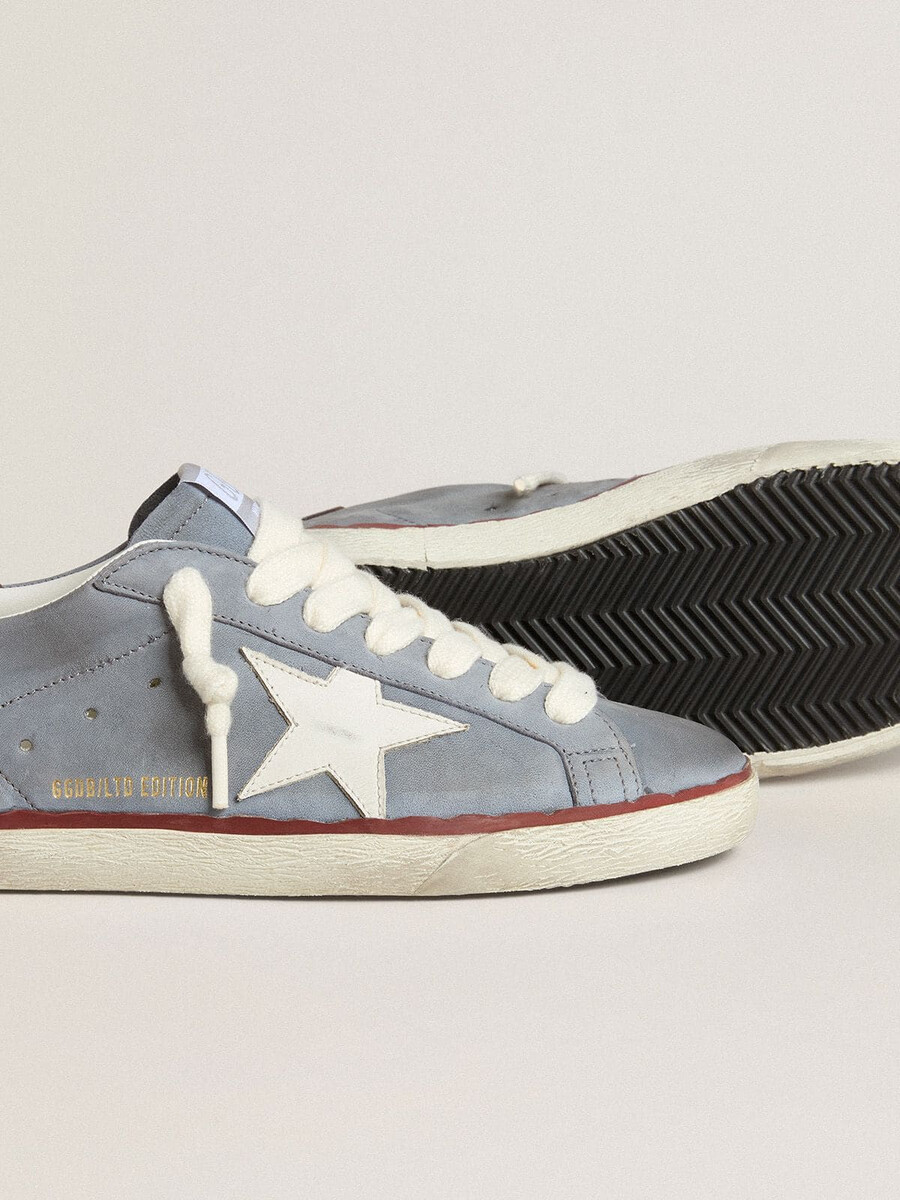 superstar ltd i ljusblått nubuckläder med vit läderstjärna och brun läderhälflik