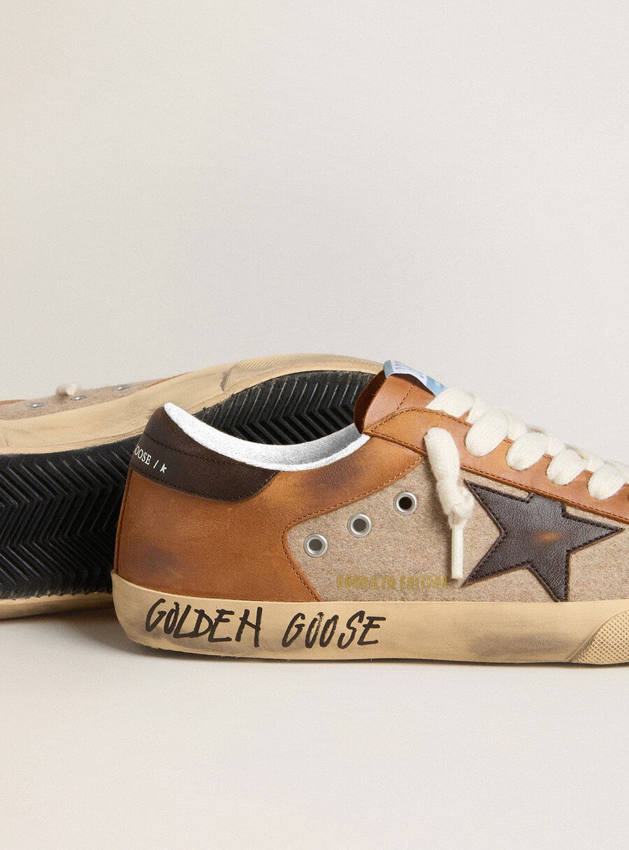 herr super-star ltd i beige ull med brun läderstjärna och kamelfärgade inlägg