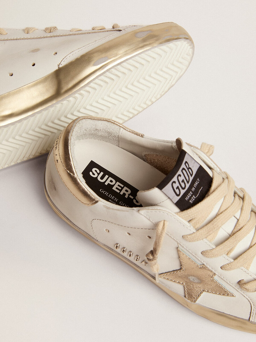 dam super-star sneakers med guldrävmönster
